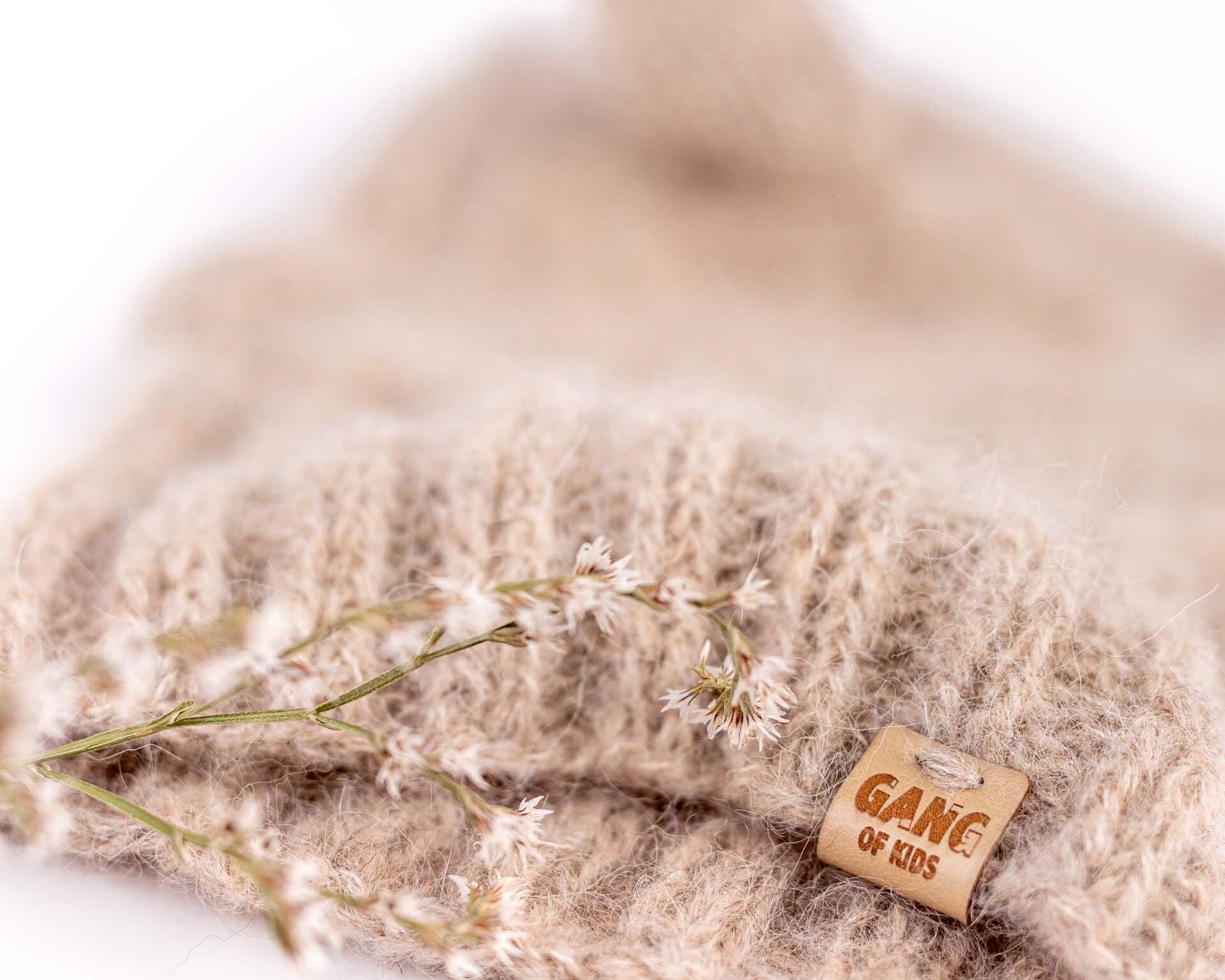 Detail of the soft hand-knitted alpaca wool texture and contrasting Light Gray inner ear of the Fairy Balaclava.
