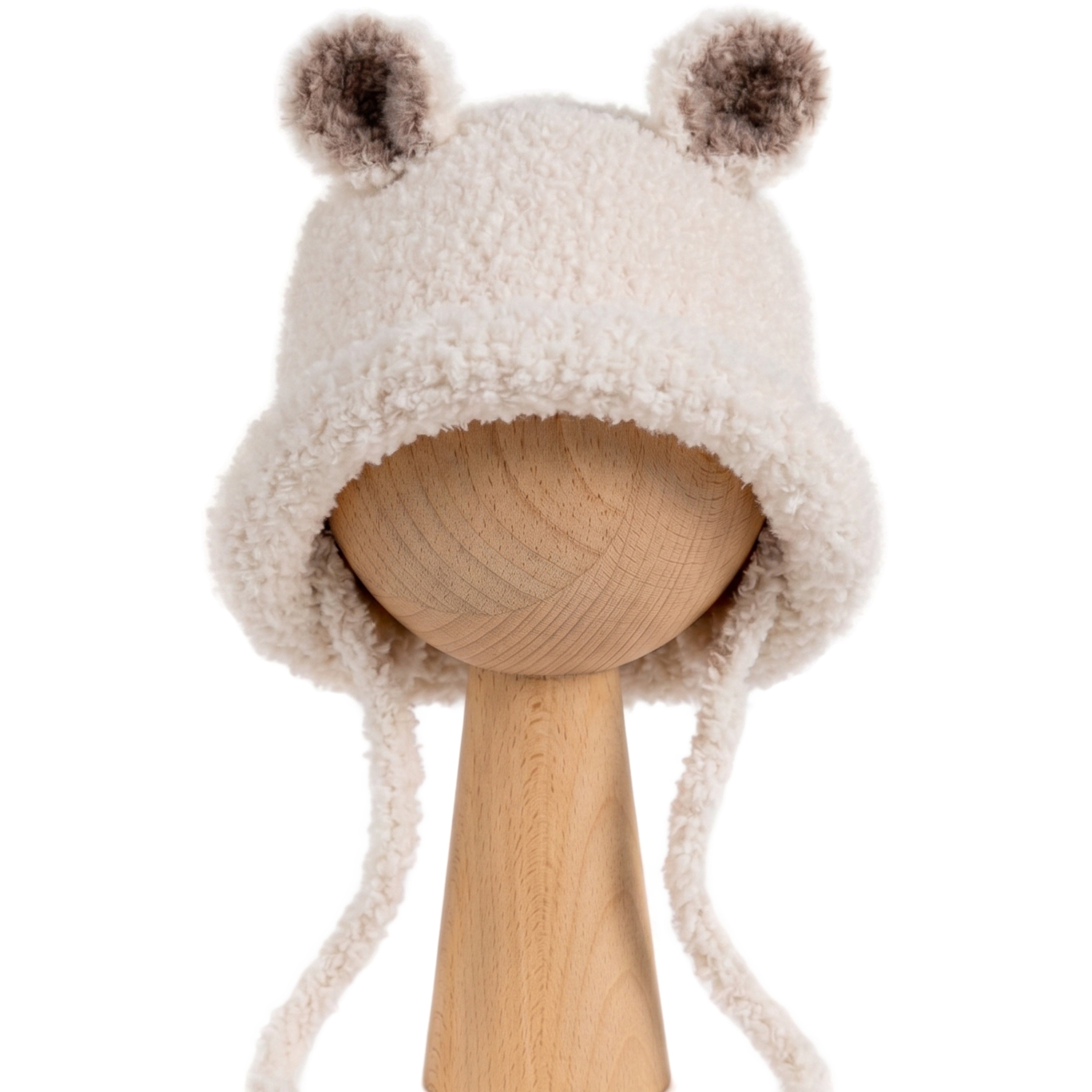 Bucket Bear Hat, a knitted winter hat with bear ears, shown in cream boucle yarn with tie-under-chin closure.